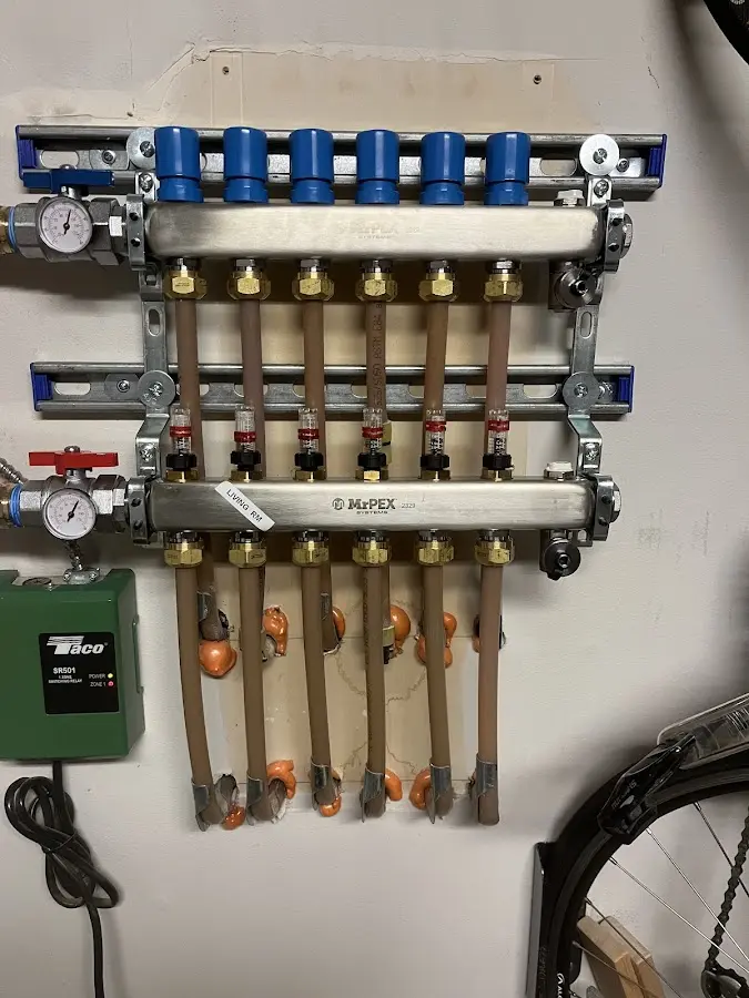 Plumber performing Water Heater Repair at a residential property in Ontario